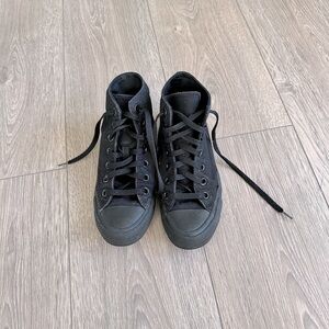Boys black high top Converse. Size 4.